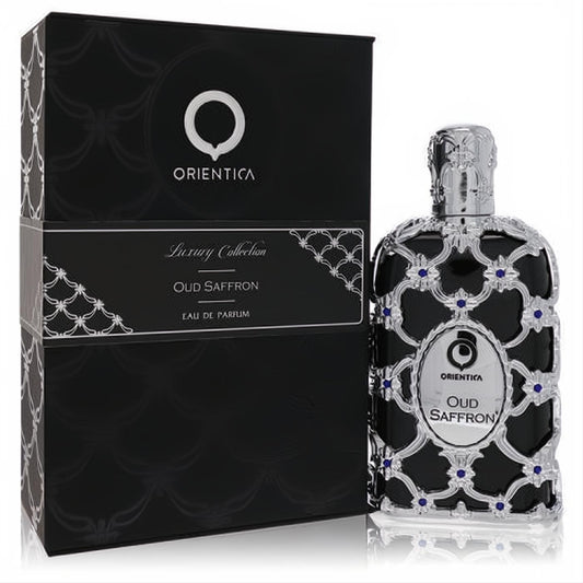 Stunning Orientica Oud Saffron perfume bottle and black box, featuring ornate silver filigree and blue details.
