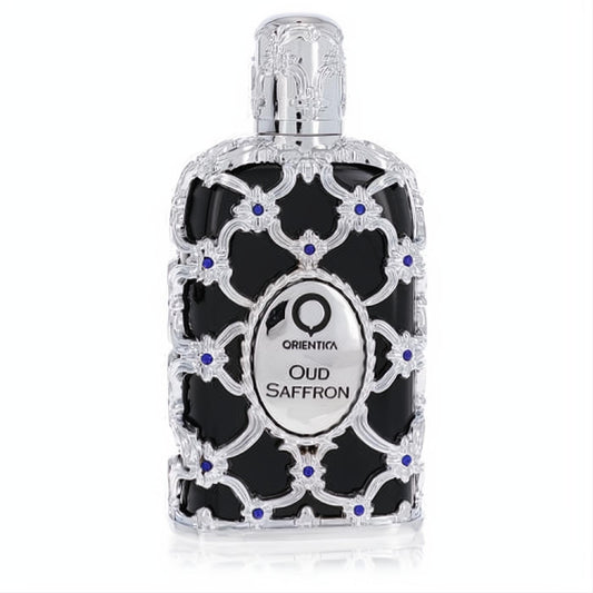 Exquisite Orientica Oud Saffron 2.7 oz EDP. Black bottle with ornate silver filigree, blue jewels, and elegant cap.