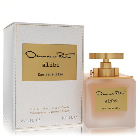 Oscar De La Renta Alibi Eau Sensuelle 3.4 oz EDP. Luxurious frosted glass bottle, elegant gold cap, and white textured box.
