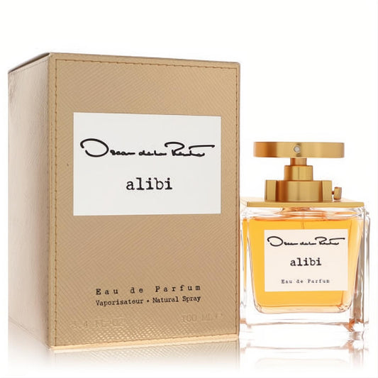 Oscar De La Renta Alibi 3.4 oz Eau De Parfum. Luxurious gold box and clear glass bottle with radiant amber fragrance, elegant gold cap.
