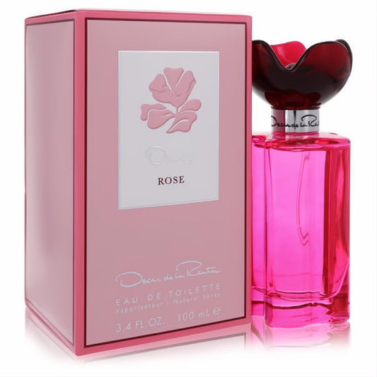 Oscar Rose 3.4 oz EDT: stunning fuchsia bottle with sculpted dark red floral cap, beside its elegant pink box featuring a raised rose.