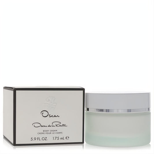 Indulge with Oscar de la Renta 5.9 oz body cream: frosted glass jar, silver lid, and elegant white and black box.