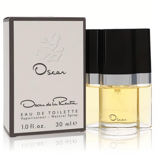 Oscar de la Renta 1 oz EDT spray. Clear glass bottle with golden amber fragrance, sleek black cap, and elegant white box.