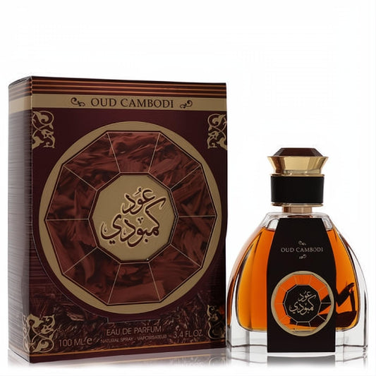 Luxurious Oud Cambodi unisex fragrance in a unique amber glass bottle with gold cap, beside its ornate maroon and gold box.