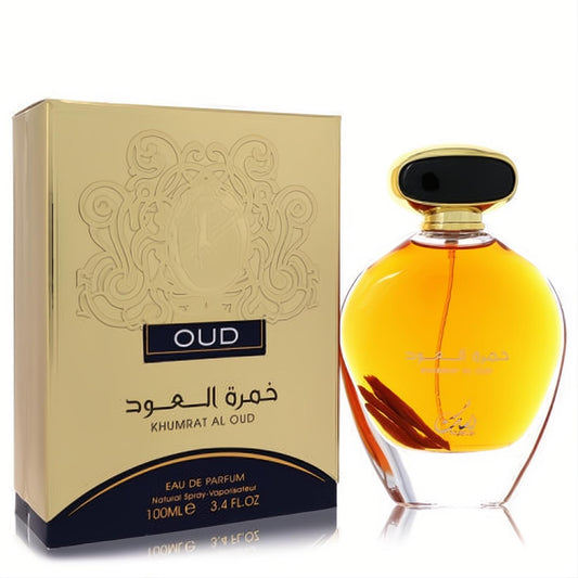 Experience Nusuk Oud Khumrat Al Oud 3.4 oz EDP. Elegant amber bottle with gold cap, luxurious ornate gold box.
