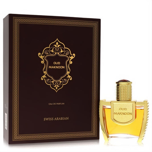 Exquisite Swiss Arabian Oud Maknoon perfume set: ornate dark brown box and a radiant gold bottle with a red jewel cap.
