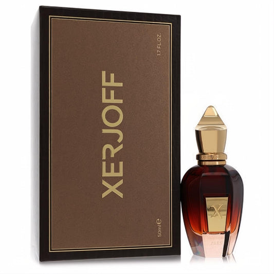 Exquisite Xerjoff Fars Oud 1.7 oz amber glass perfume bottle with ornate gold cap, beside its luxurious brown and gold box.