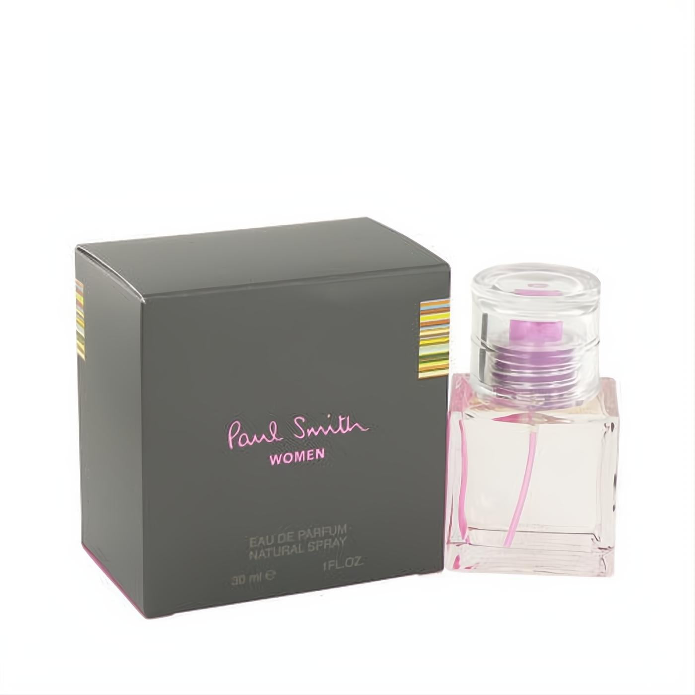 Paul Smith Women 1 oz Eau De Parfum spray in a clear glass bottle with pink liquid, next to its elegant grey box with signature stripes.