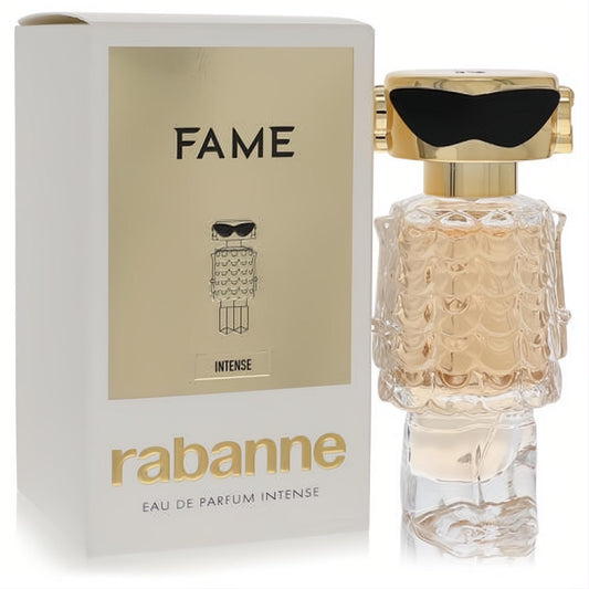 Paco Rabanne Fame Intense 1 oz women's EDP. Dazzling gold robot bottle, black sunglasses, and clear textured body.