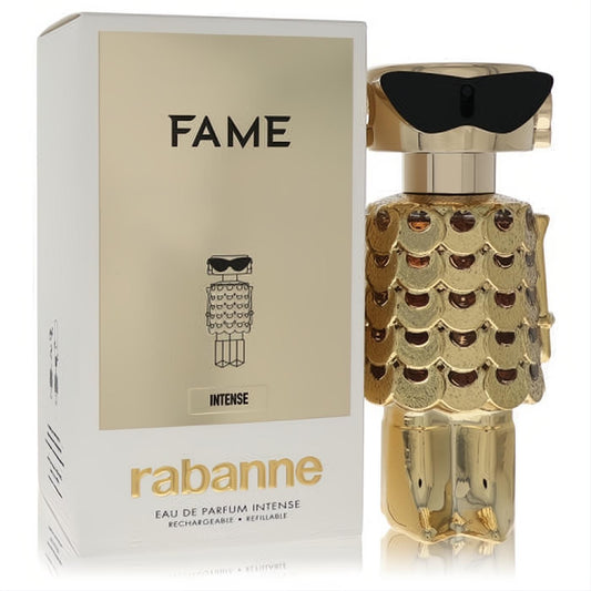 Striking Paco Rabanne Fame Intense gold robot perfume bottle with black sunglasses and metallic scales, beside its elegant white and gold box.