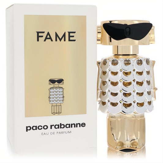 Paco Rabanne Fame 1.7 oz Eau De Parfum. Dazzling gold robot bottle with silver scales and chic black sunglasses.