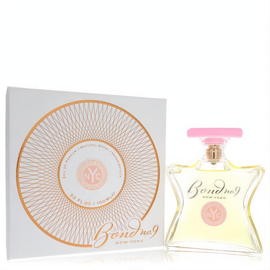 Luxurious Bond No. 9 Park Avenue 3.3 oz Eau De Parfum. Clear glass bottle with pink cap, white box featuring a unique gold sunburst design.
