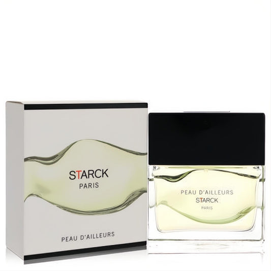 Starck Paris Peau D'ailleurs unisex EDT. Modern clear glass bottle with light yellow liquid, distinctive wavy design, black cap, and elegant white box.)