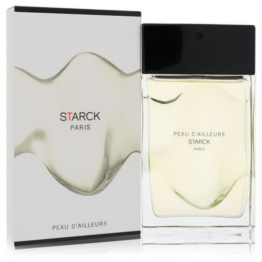 Starck Paris Peau D'ailleurs 3 oz unisex EDT. Modern clear glass bottle with pale liquid, sleek black cap, and elegant white wavy box.