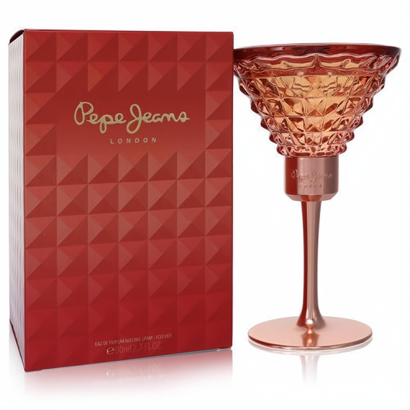 Pepe Jeans London women's 2.7 oz EDP. Chic rose gold cocktail glass bottle with textured design, beside its vibrant red geometric box.