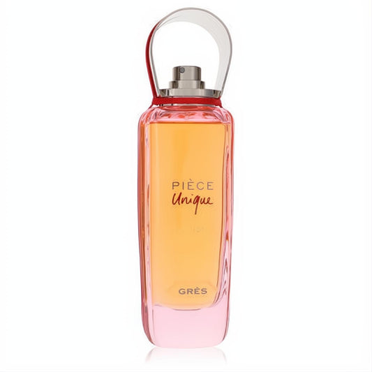 Exquisite Pièce Unique by Gres perfume. Amber liquid in a sleek glass bottle with pink base and unique clear loop cap with red accent.