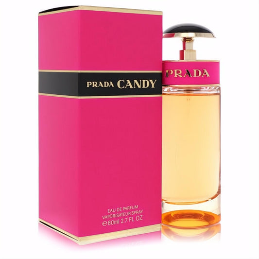 Prada Candy 2.7 oz Eau De Parfum: vibrant pink box, elegant bottle with golden liquid, black cap, and gold accents.