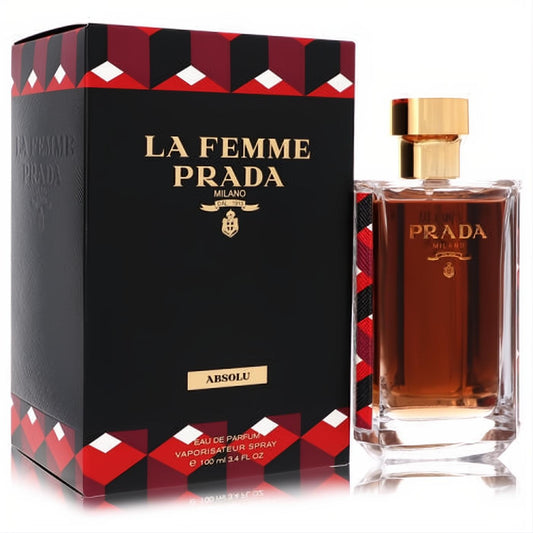 Prada La Femme Absolu 3.4 oz EDP. Amber fragrance in a sleek glass bottle with gold cap, beside its black and red patterned box.