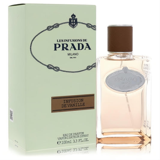 Prada Infusion De Vanille 3.3 oz EDP. Clear glass bottle with warm peach liquid, brown cap, and elegant light green box.