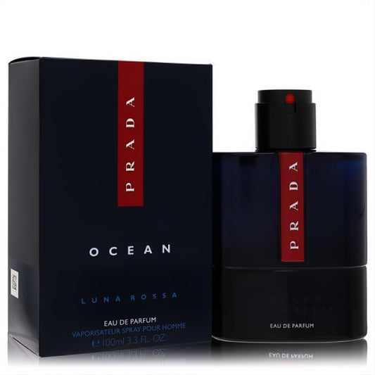 Prada Luna Rossa Ocean 3.3 oz men's Eau De Parfum. Sleek navy blue bottle and matching box with iconic red stripe design.