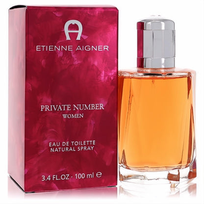 Private Number Etienne Aigner women's EDT. Amber fragrance in a sleek glass bottle with silver cap, next to its vibrant red box.**