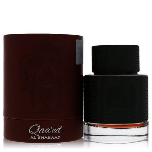 Qaaed Al Shabaab by Lattafa 3.4 oz unisex fragrance. Features a textured black bottle with amber liquid and a luxurious dark red-brown box.