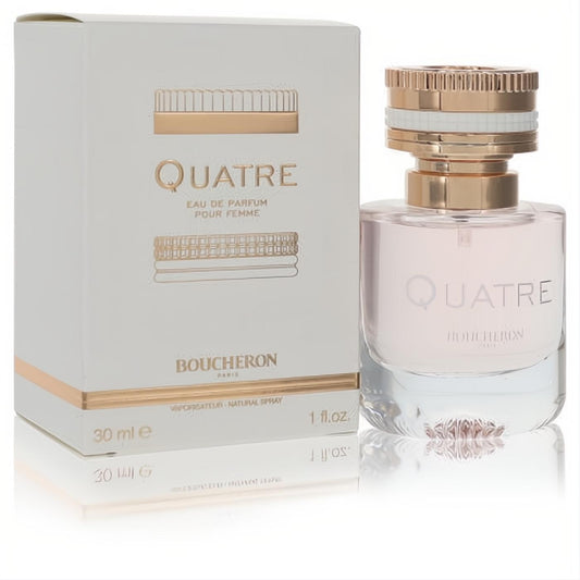 Luxurious Boucheron Quatre women's Eau De Parfum. Elegant clear glass bottle with light pink liquid, rose gold cap, and white box. 1 fl.oz.