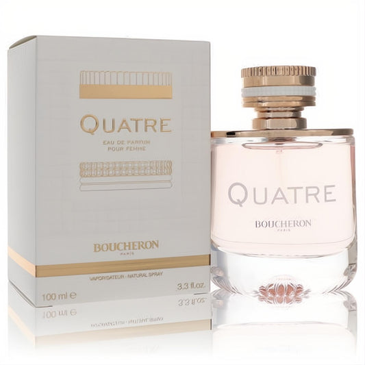 Sophisticated Boucheron Quatre 3.3 oz women's EDP, featuring a clear bottle with light pink liquid, rose gold cap, and its chic white and gold box.