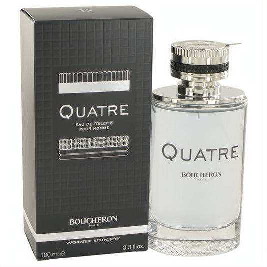 Elegant Boucheron Quatre men's cologne: sleek 3.3 oz clear glass bottle with silver cap next to its black textured box.