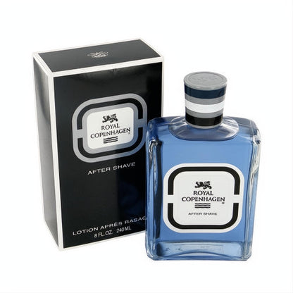 Royal Copenhagen After Shave 8 oz blue lotion in a classic clear glass bottle and elegant black box. Refined masculine fragrance.