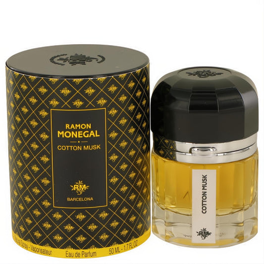 Ramon Monegal Cotton Musk 1.7 oz EDP spray in a clear faceted bottle with black cap, beside its elegant black and gold patterned cylindrical box.