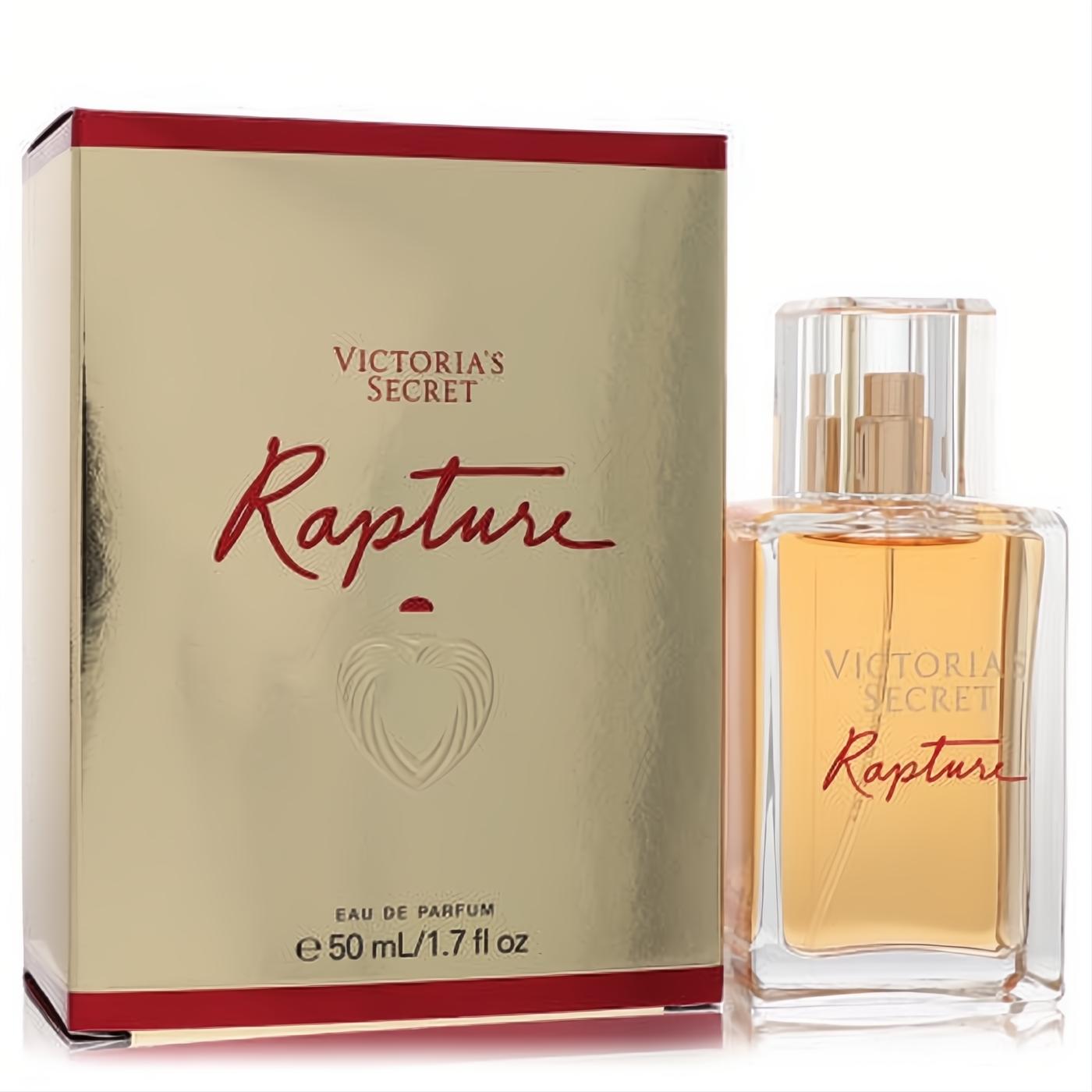 Victoria's Secret Rapture 1.7 oz Eau de Parfum. Clear glass bottle with golden liquid, next to its elegant gold and red box.