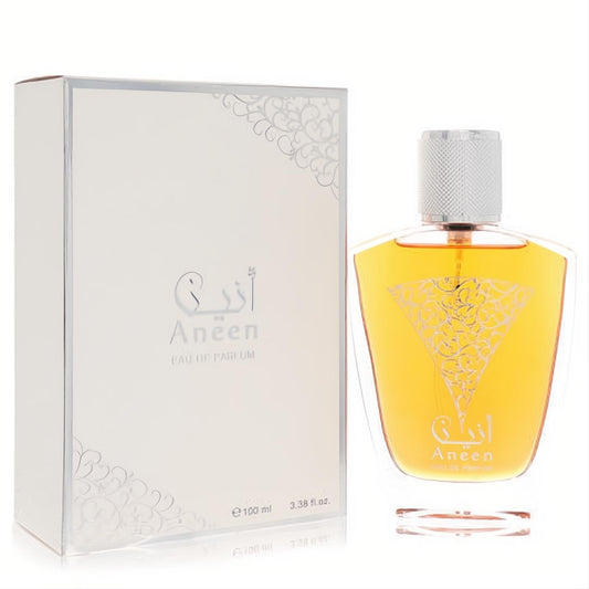 Rasasi Aneen unisex Eau De Parfum, 3.38 oz. Amber liquid in a unique glass bottle with silver cap and elegant arabesque design.