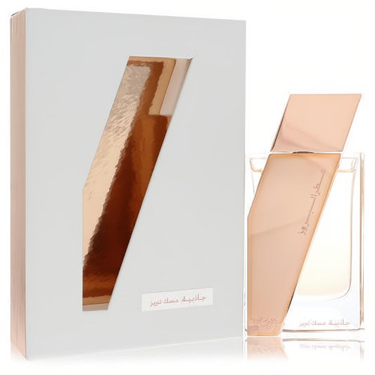Exquisite Rasasi Attar Al Boruzz Jazeebiyat Musk Tabriz 1.7 oz unisex EDP. White box with angled rose gold cutout, clear bottle with matching cap.