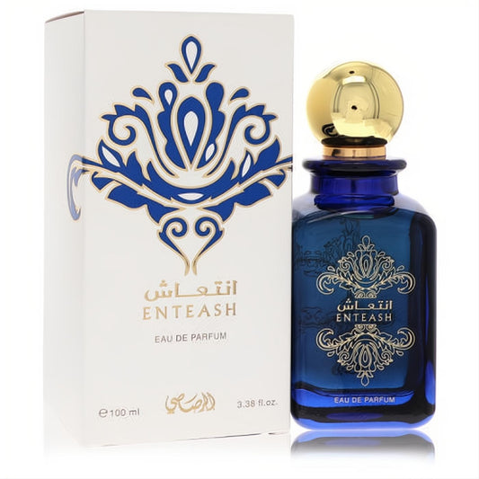 Rasasi Enteash 3.3 oz unisex Eau De Parfum. Features an elegant dark blue glass bottle with a luxurious gold cap and intricate gold design.