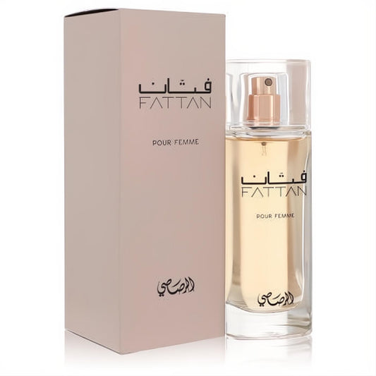 Rasasi Fattan Pour Femme 1.67 oz women's EDP spray. Clear glass bottle with gold accents, beside its elegant blush box.