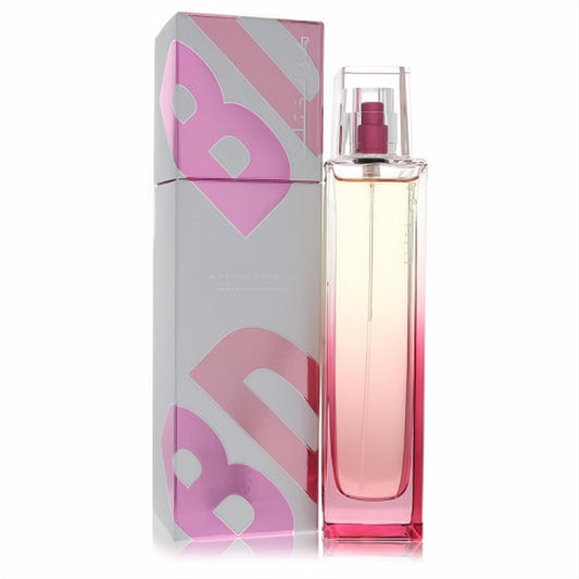 Rasasi Kun Mukhtalifan 3.4 oz EDP spray. Sleek bottle with captivating pink ombre liquid and a chic, metallic pink-accented box.