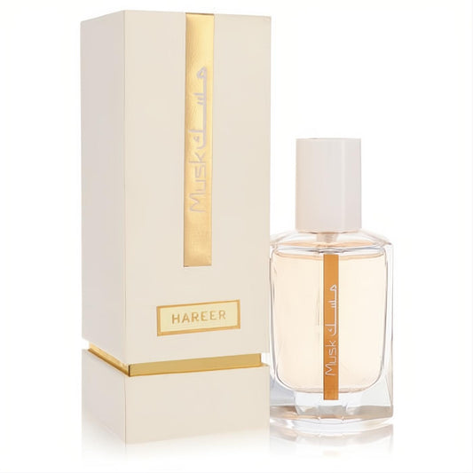 Luxurious Rasasi Musk Hareer 1.67 oz unisex EDP. Clear bottle with golden liquid, white cap, and elegant cream-gold box.
