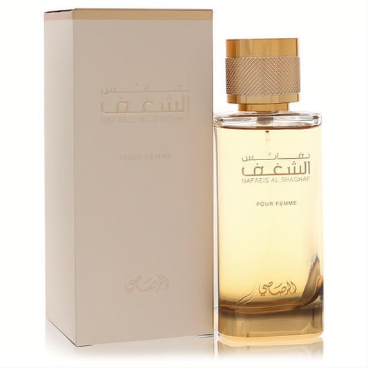 Luxurious Rasasi Nafaeis Al Shaghaf 3.4 oz women's EDP. Elegant clear bottle with golden liquid, textured gold cap, and matching cream box.