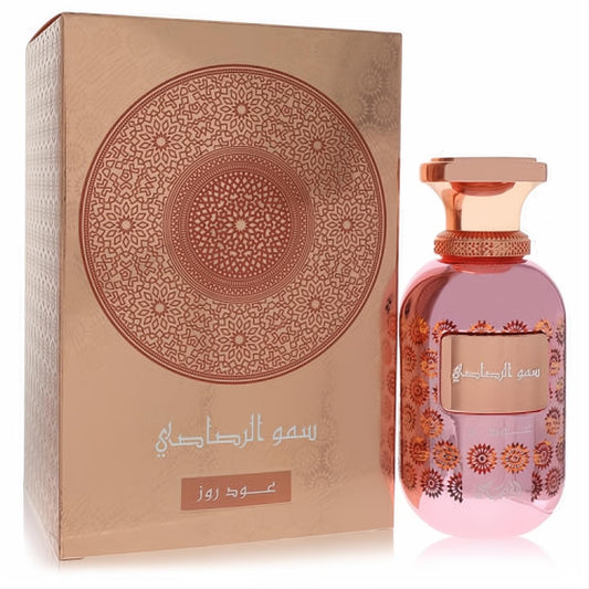 Captivating Rasasi Oud Rose unisex perfume in a shimmering rose gold bottle with ornate patterns and a luxurious matching box.