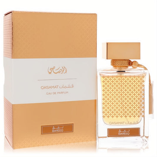 Rasasi Qasamat Bareeq 2.2 oz unisex EDP. Golden bottle with intricate design, tassel, and elegant matching box.