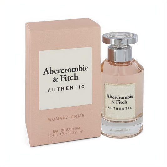 Elegant Abercrombie & Fitch Authentic Woman Eau De Parfum 3.4 oz. Light pink box and clear glass bottle with a sleek silver cap.