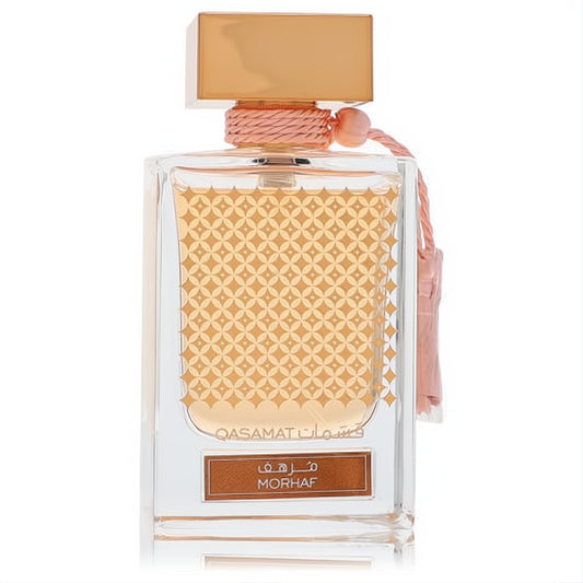 Discover Rasasi Qasamat Morhaf 2.2 oz unisex EDP. Luxurious clear bottle, gold geometric design, rose gold cap, and chic pink tassel.