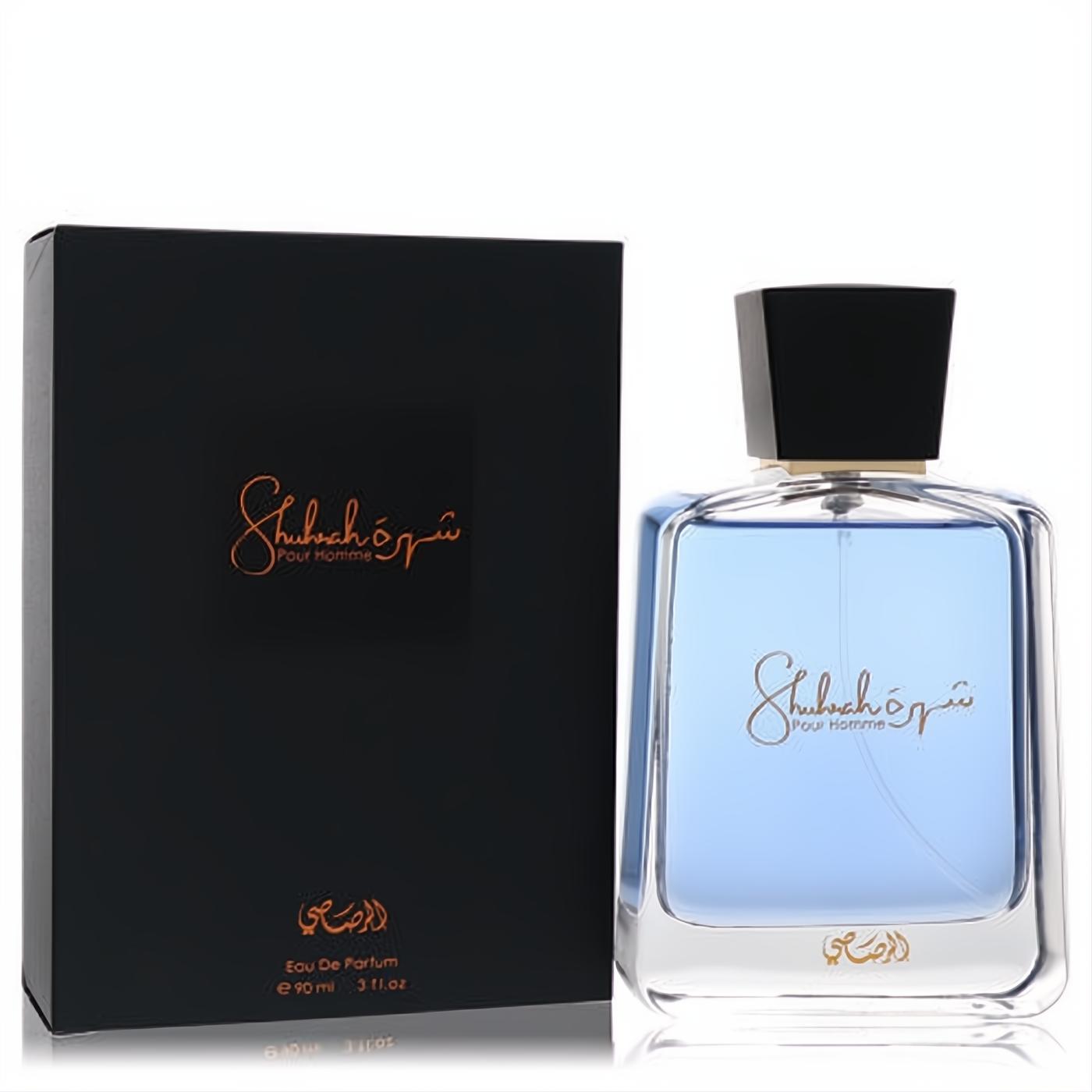 Sophisticated Rasasi Shuhrah 3 oz men's EDP. Features a clear blue glass bottle with gold script and a sleek matte black box.