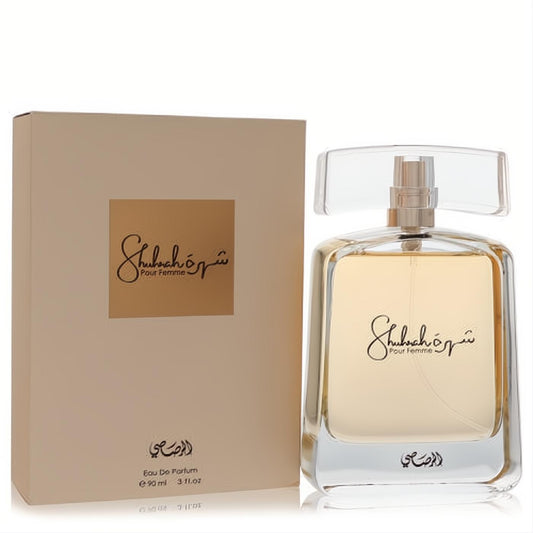 Discover Rasasi Shuhrah 90ml women's Eau De Parfum. Elegant clear glass bottle with golden liquid, alongside its chic beige box.