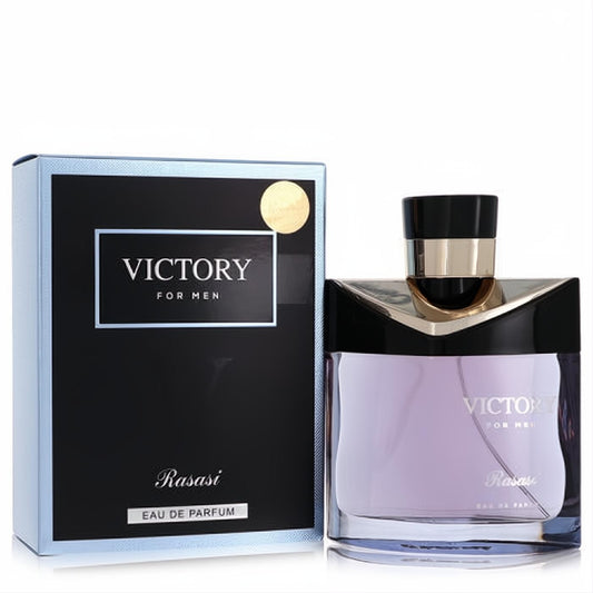 Rasasi Victory for Men 3.3 oz Eau De Parfum. Clear glass bottle with purple fragrance, black/gold cap, beside its sleek black/blue box.