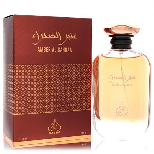 Rayef Amber Al Sahraa 3.4 oz unisex EDP. Elegant amber bottle with a unique rose gold cap, beside its luxurious ornate reddish-brown box.