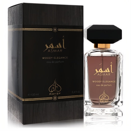 Elegant Rayef Asmar Woody Elegance 3.4 oz unisex EDP. Clear bottle with amber liquid, black faceted cap, and a dark wood-grain box.