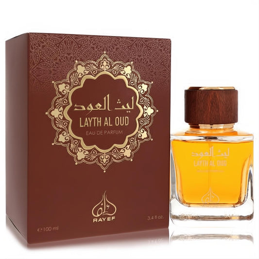 Sophisticated Rayef Layth Al Oud 3.4 oz EDP. Amber fragrance in a clear bottle with a wood cap, paired with its ornate gold and brown box.