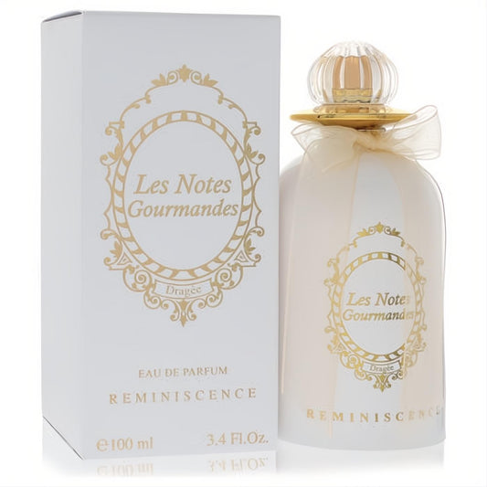 Reminiscence Dragee 3.4 oz EDP. Elegant white bottle with ornate gold 'Les Notes Gourmandes' design, clear cap, and sheer ribbon. Matching box.